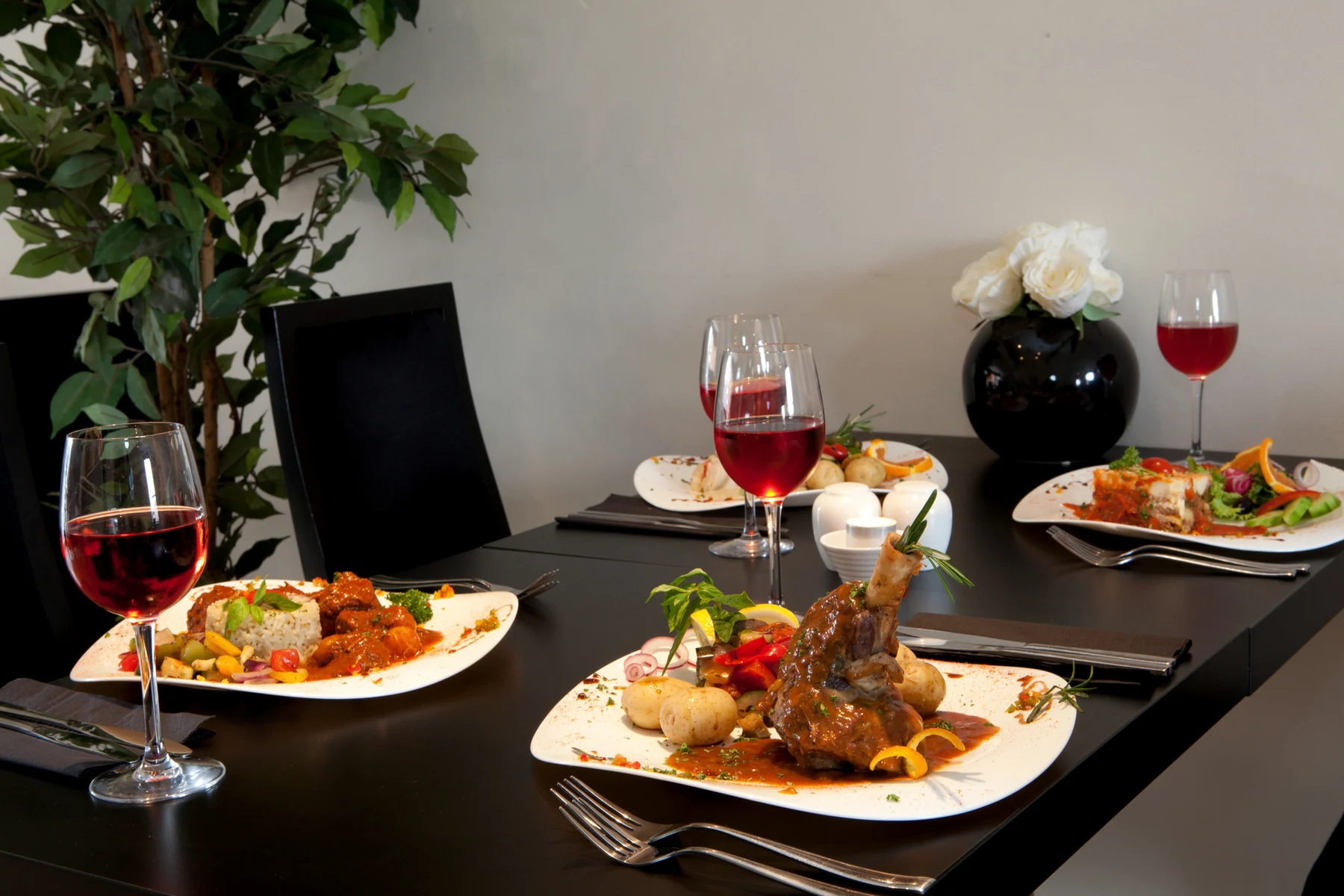A warmly set celebration table at El Greco