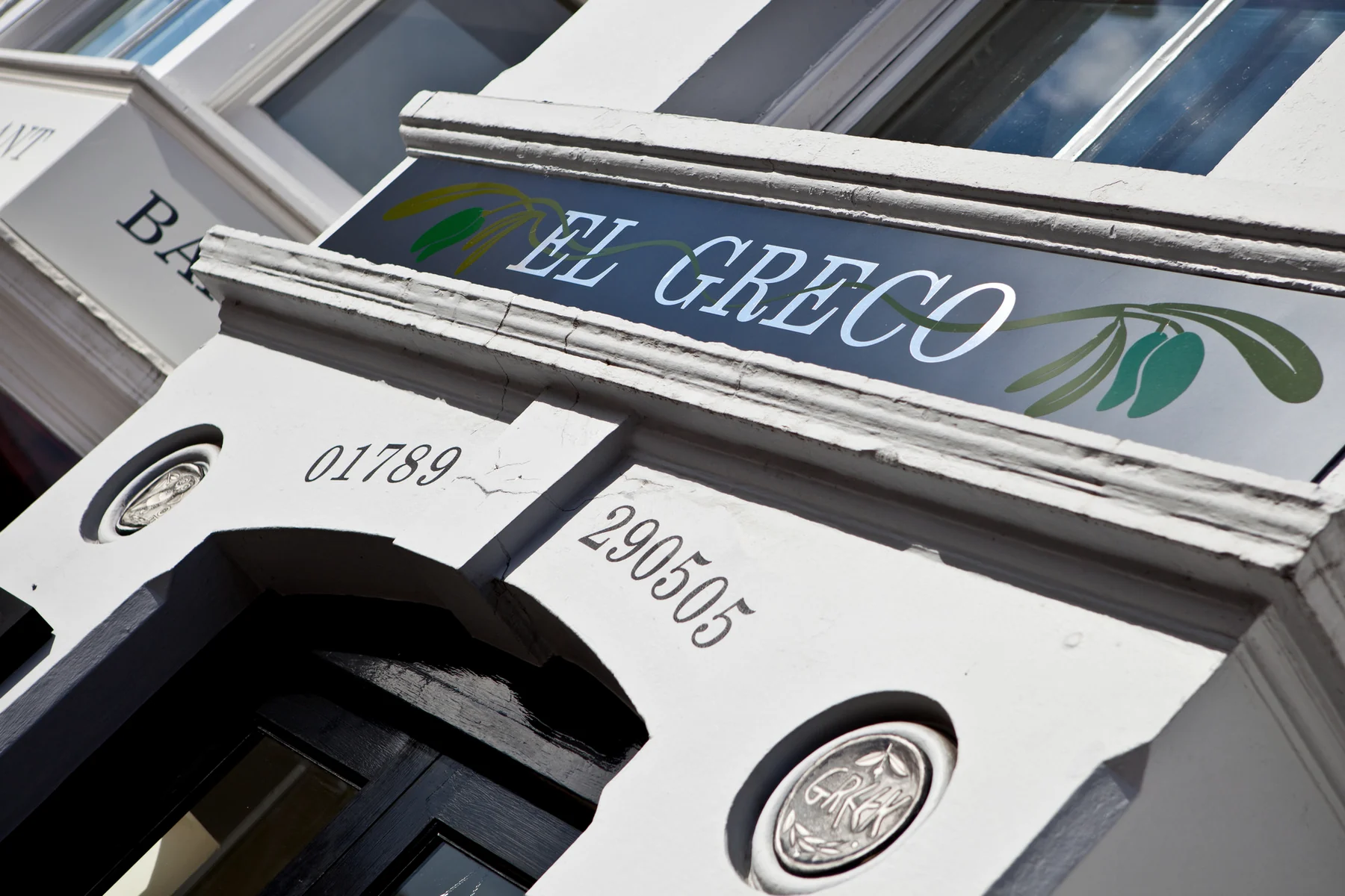 The historic white exterior of El Greco in Stratford-upon-Avon